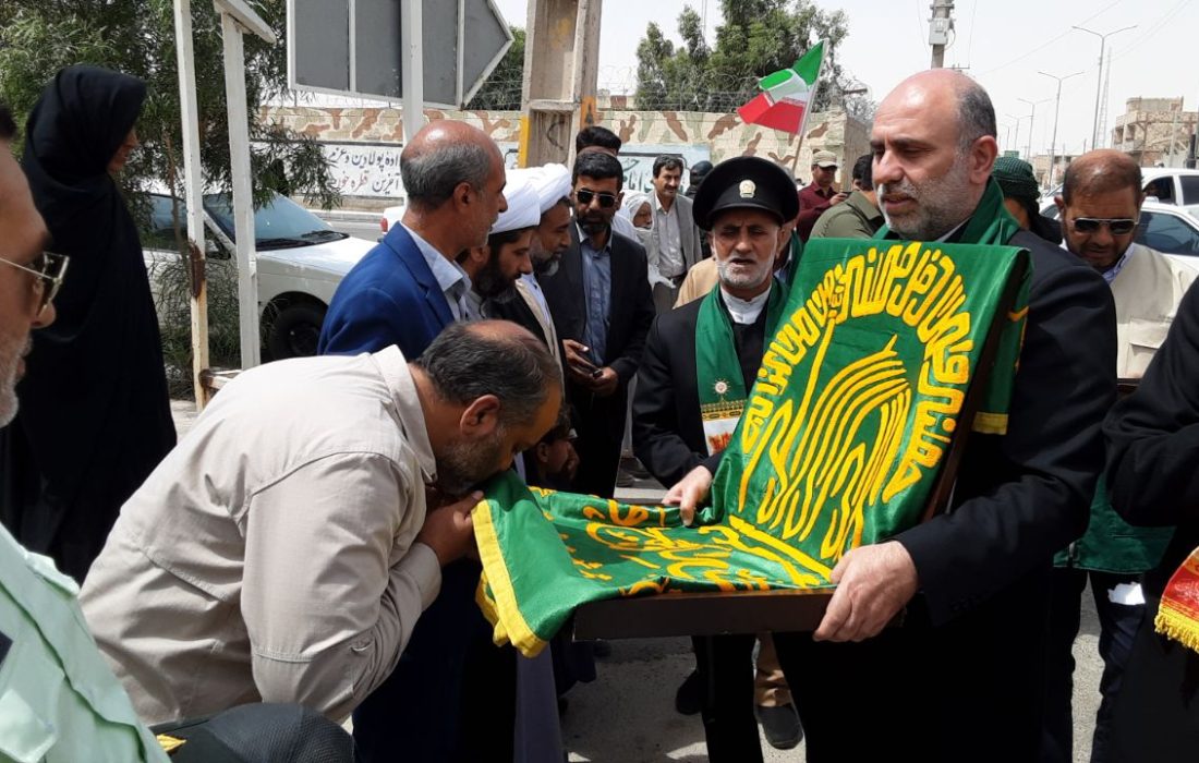 حضور خادمین رضوی وپرچم متبرک حرم امام رضا (علیه السلام) در هیرمند